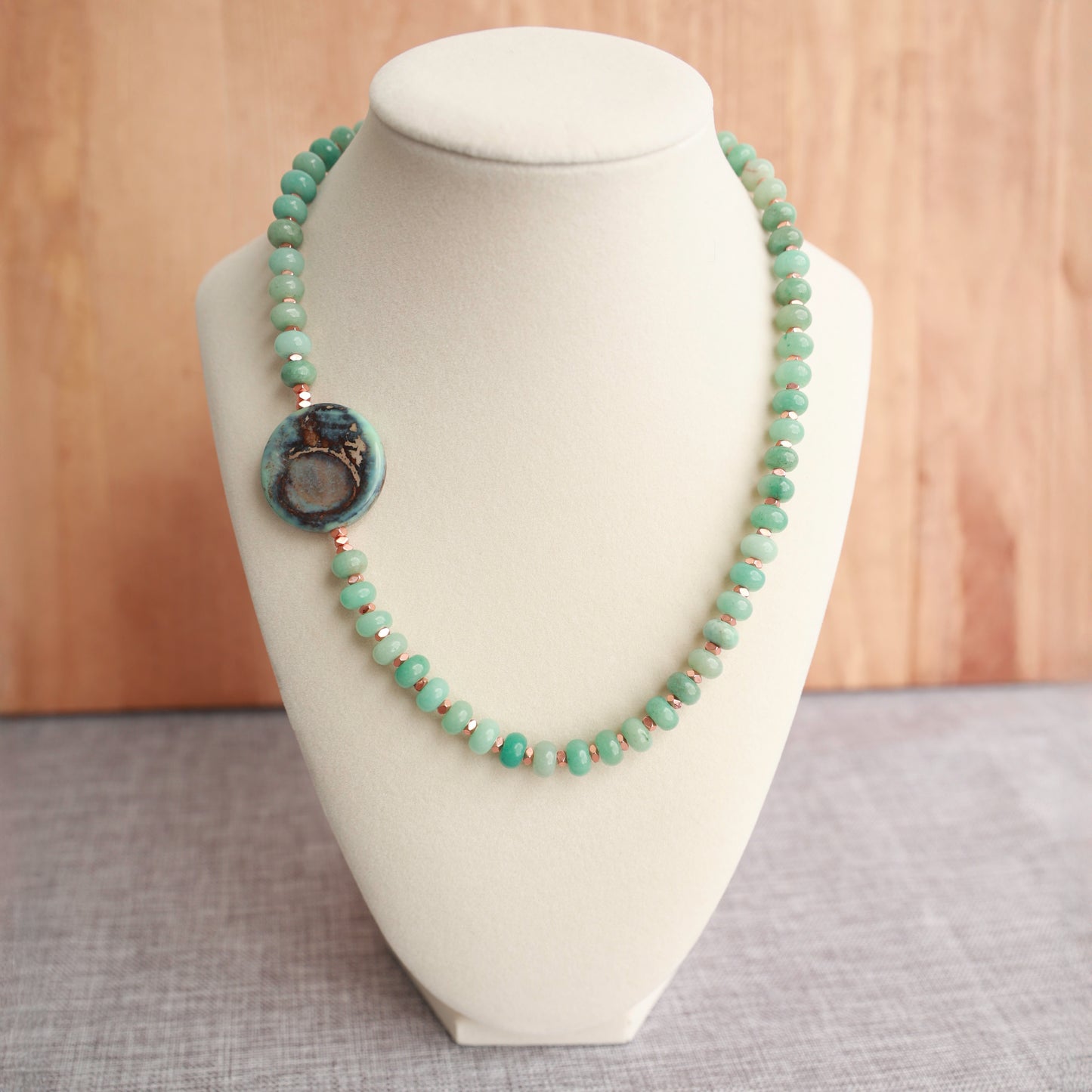 Amazonite Rondelles with Copper colored Hematite Spacers w/Offset Agate focal. 18 inches w/ 2 inch Gold Plated Stainless extender