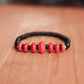 Red Dyed Graduated stone with Obsidian Disks